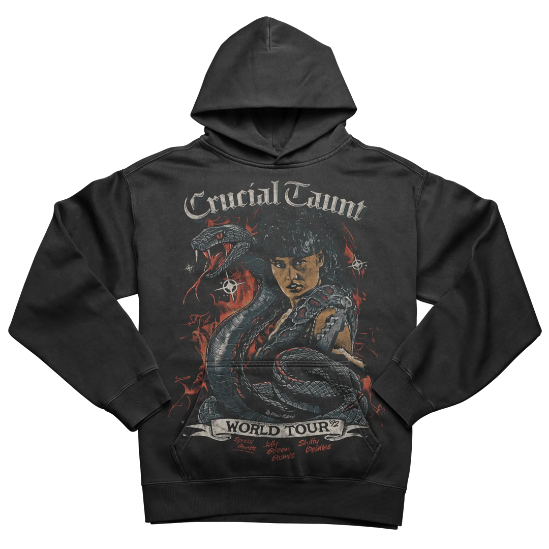 Black hoodie with a vivid graphic print featuring a woman, a snake, and ’Crucial Taunt World Tour’ text.