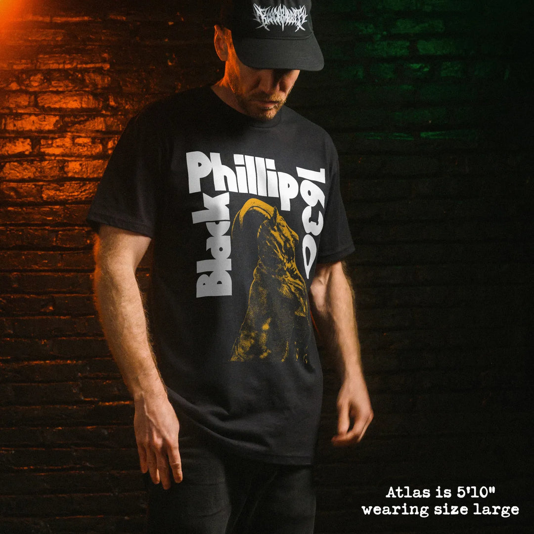 Male model wearing black premium tee with Black Phillip graphic 