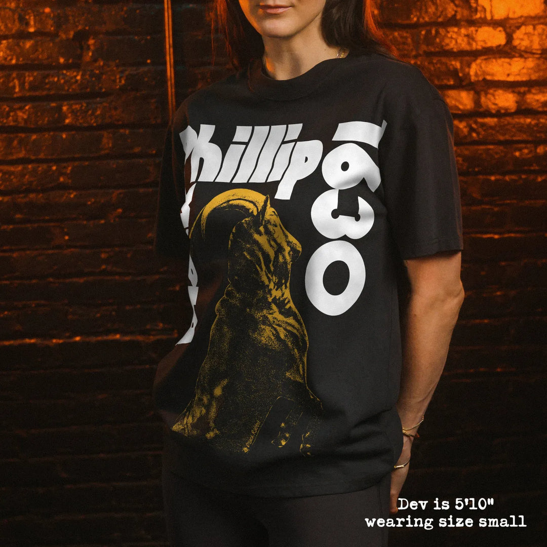 Model wearing heavy tee with black phillip sabbath graphic 