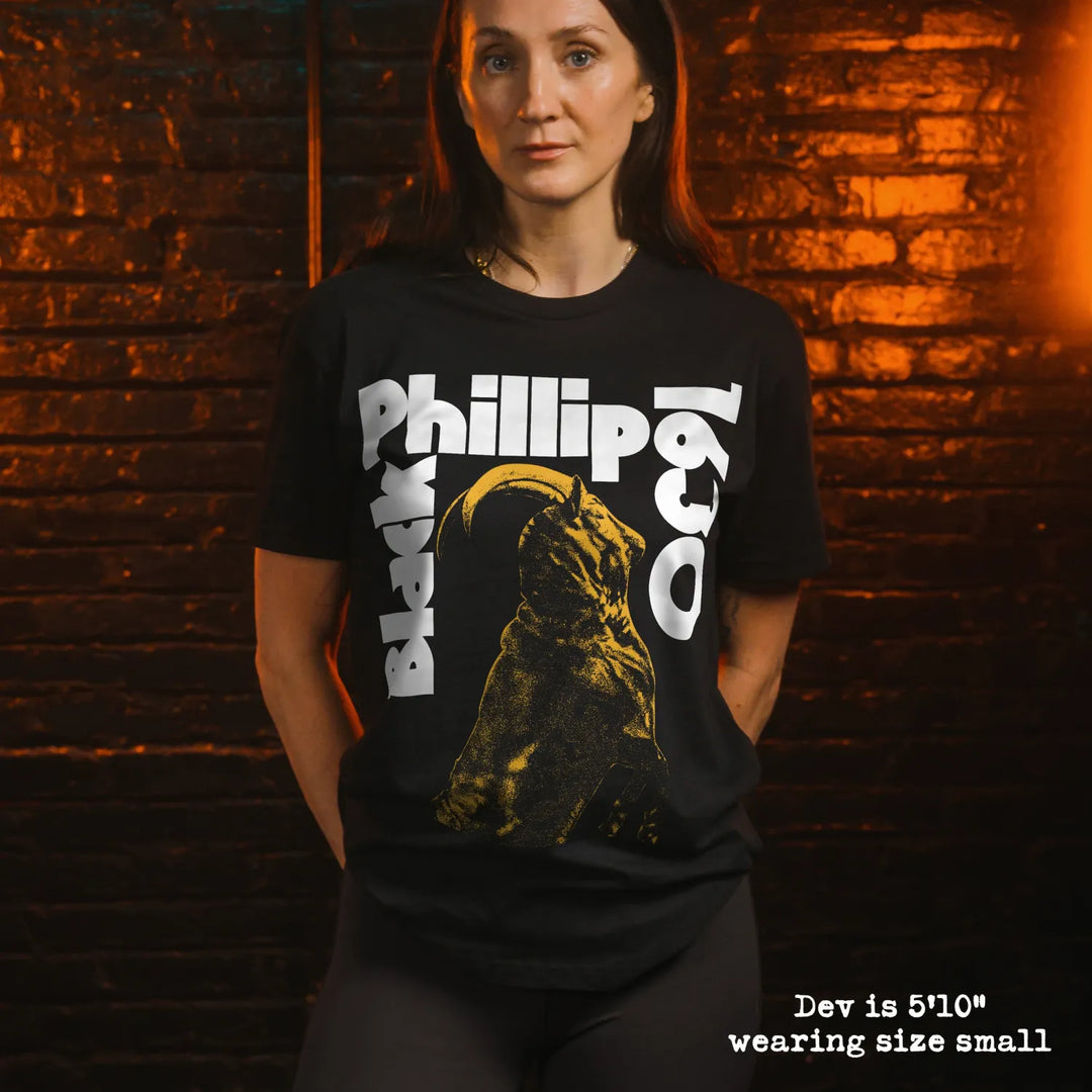 Model wearing black premium tee with black phillip graphic 