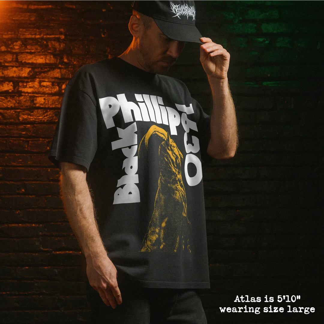 Model wearing heavy tee with black phillip sabbath graphic 