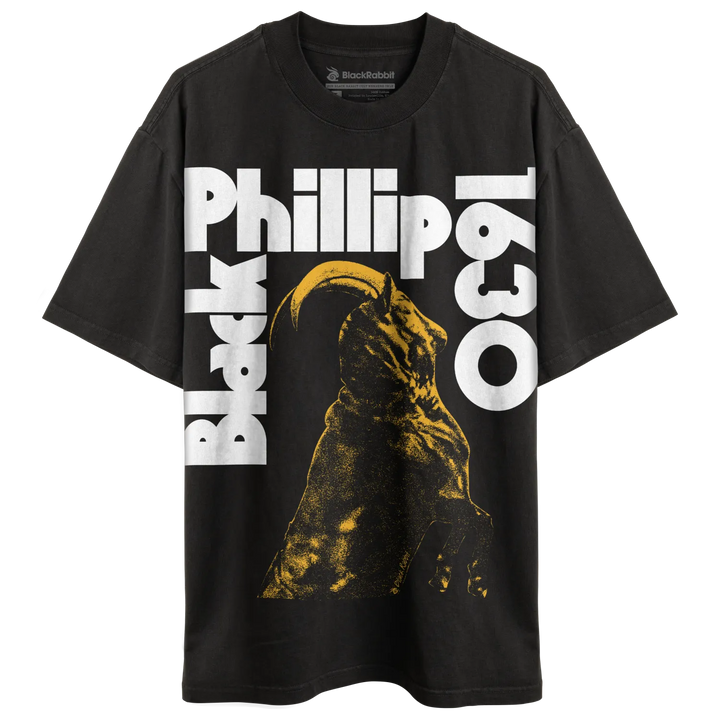 Black t-shirt with a yellow and black graphic of a horned creature and white text.