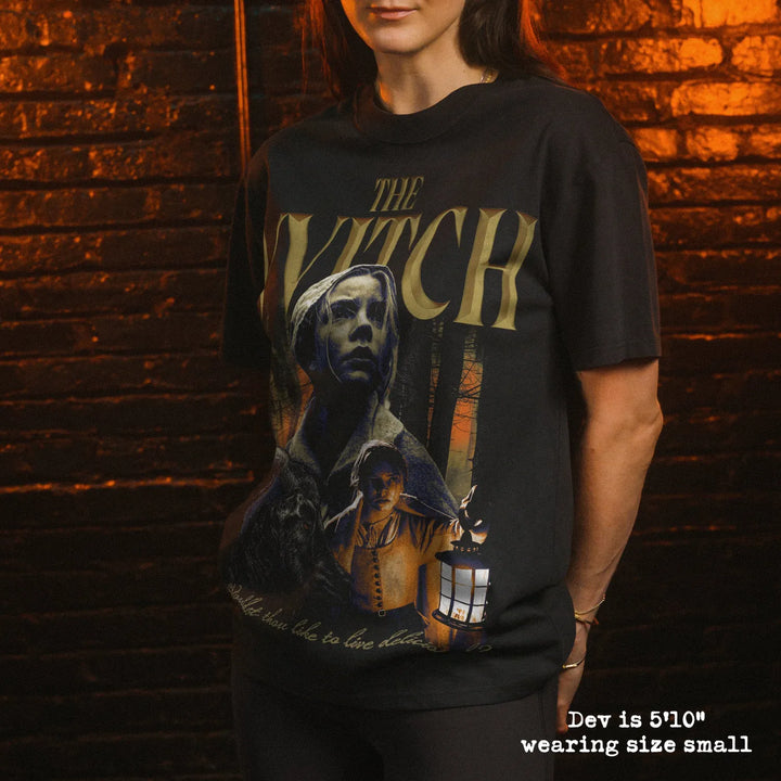 Model wearing heavy tee with the witch graphic 