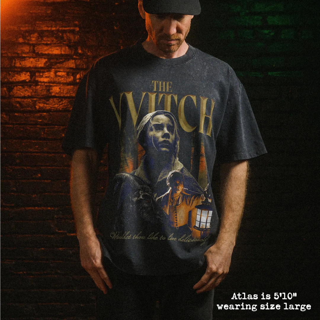 Male model wearing heavy stone washed tee with the witch graphic. 
