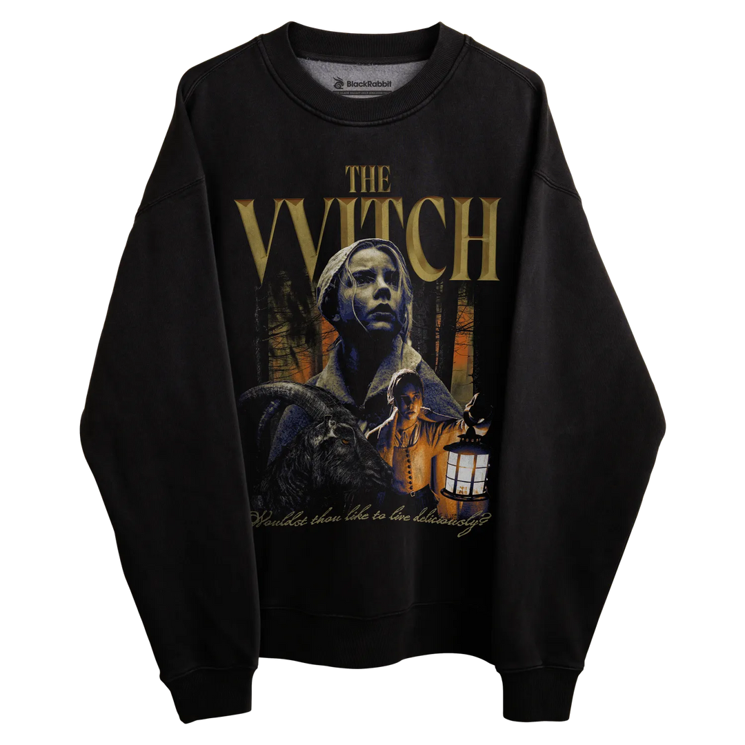 Black sweatshirt with ’the witch’ graphic design featuring a woman and dog, dark background.