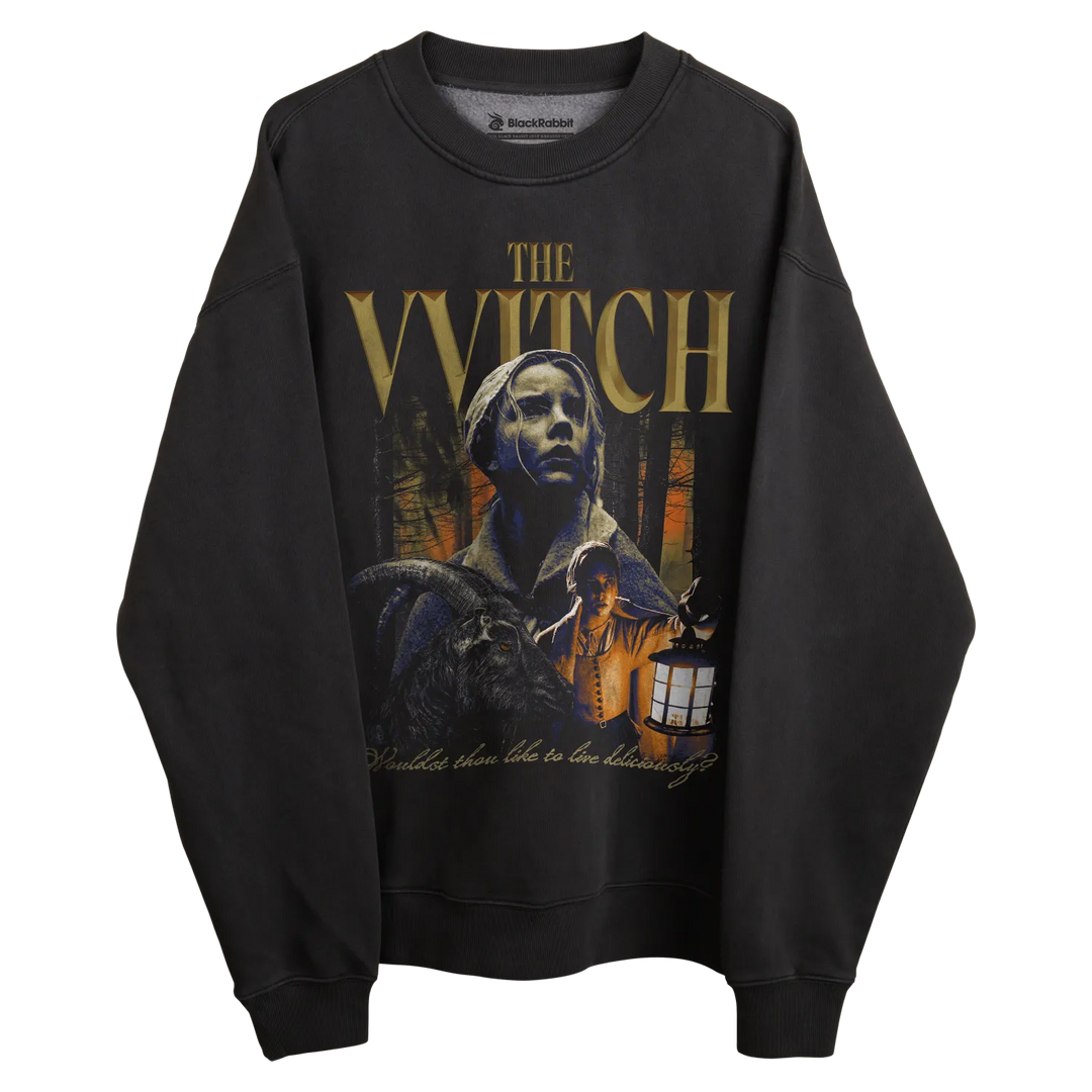 Black sweatshirt with ’the witch’ graphic design featuring a woman and house silhouette, printed on front.