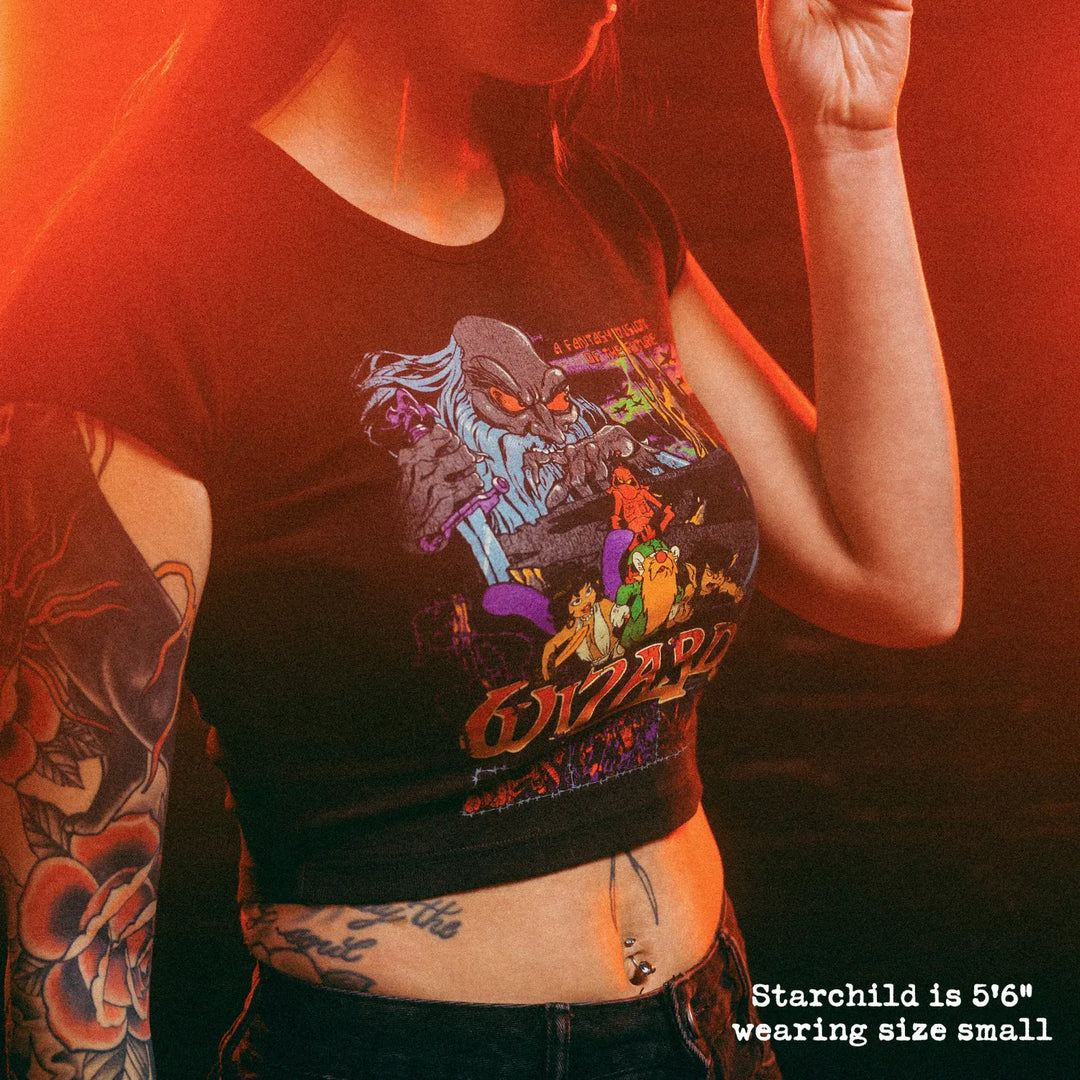 Female model wearing cropped baby tee with wizards graphic
