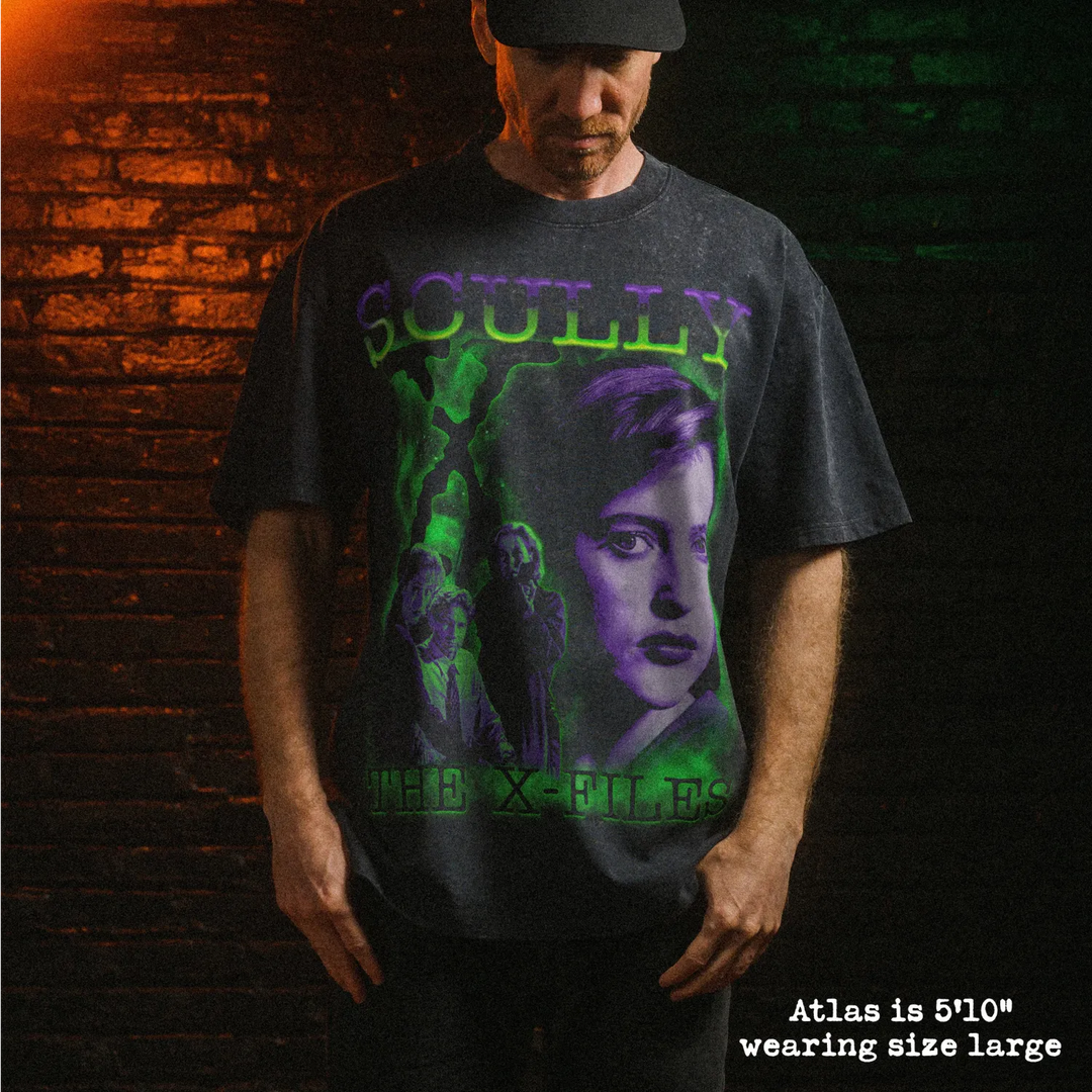 Male model wearing heavy stone washed tee with scully graphic. 