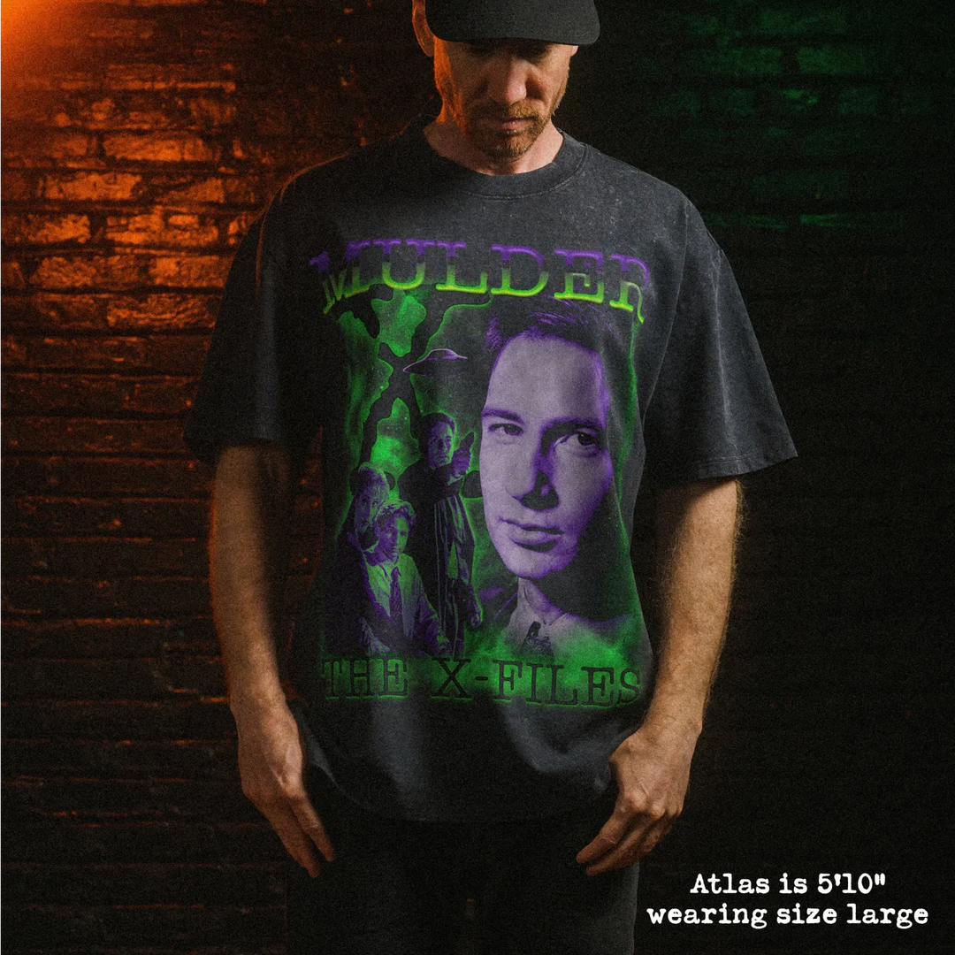 Male model wearing heavy stone washed tee with mulder graphic. 