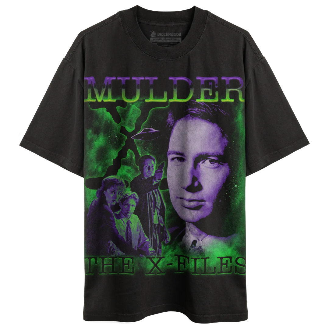 Black t-shirt with a green and purple graphic print of ’Mulder’ from The X-Files.