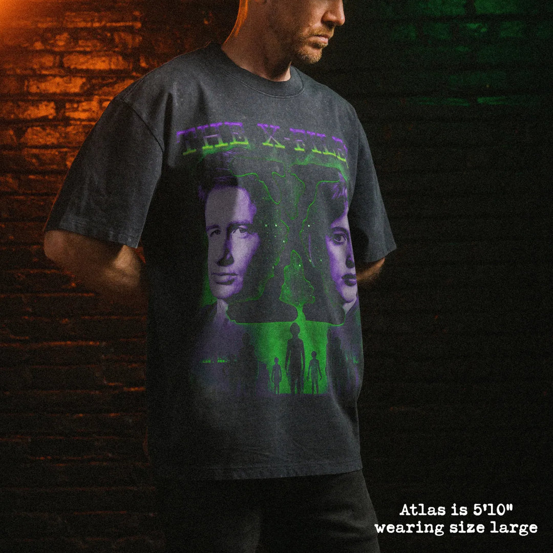 Male model wearing stone wash heavy tee with x files graphic 