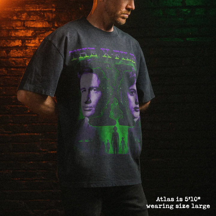 Male model wearing stone wash heavy tee with x files graphic 