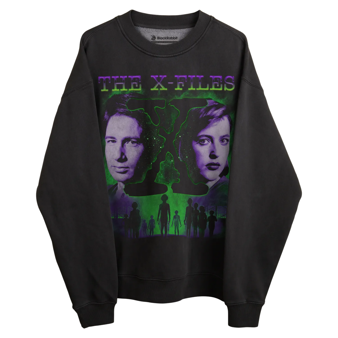 Black crewneck sweatshirt with ’the x-files’ graphic featuring mulder and scully, green alien silhouette, purple text.