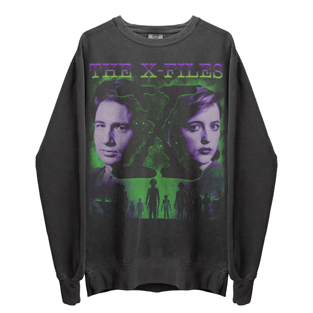 A dark gray crew-neck sweatshirt with a green and purple graphic print of ’The X-Files’ characters.