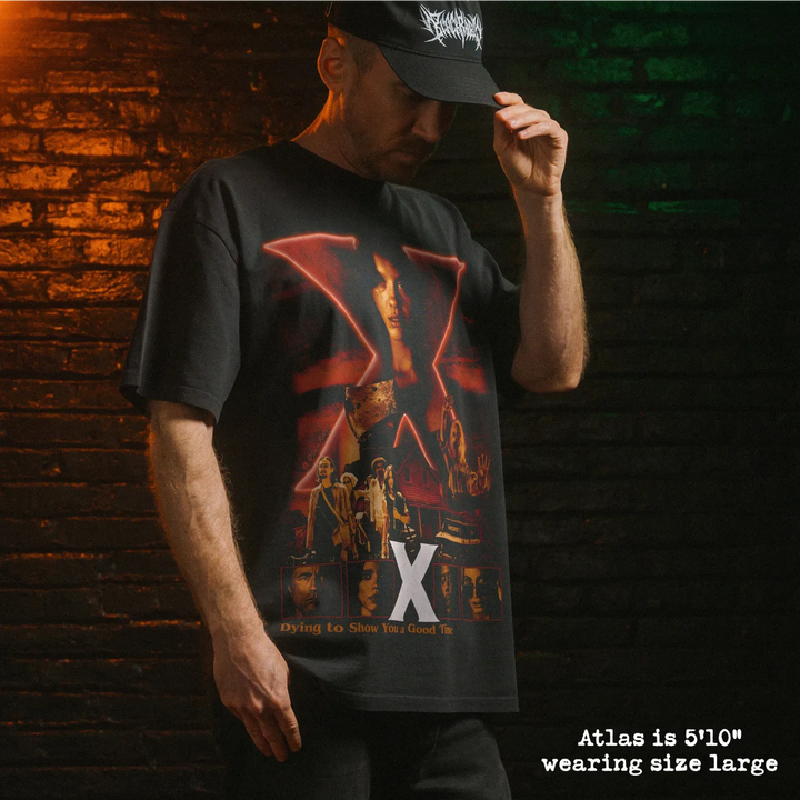 Model wearing heavy tee with X graphic 