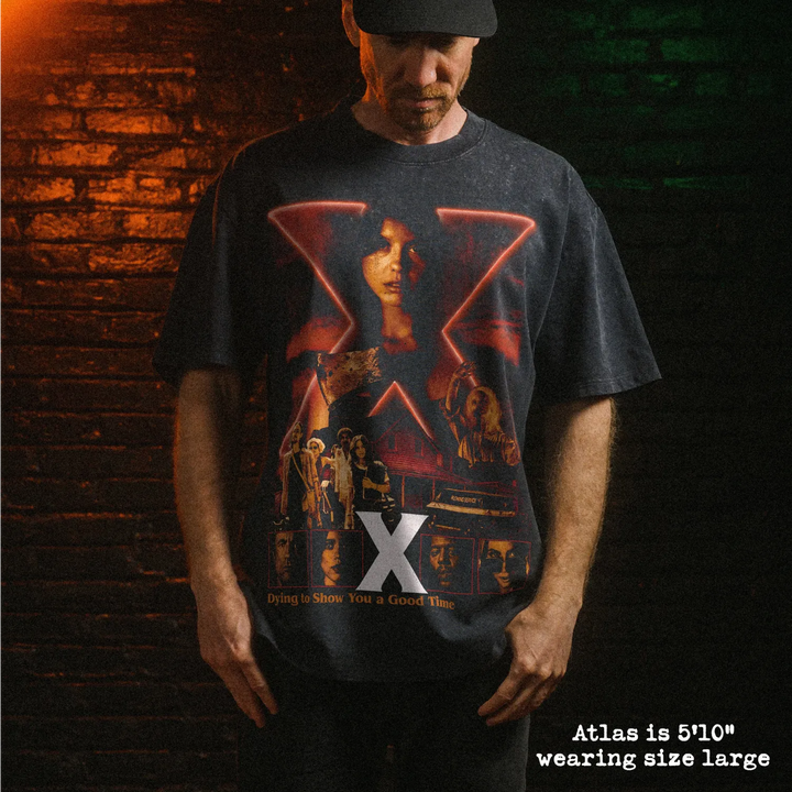 Male model wearing heavy stone washed tee with X graphic. 